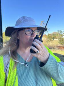 Kate demonstrates using a handheld radio